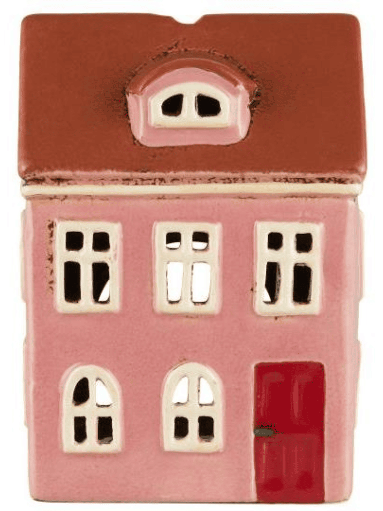 Photophore maison en céramique rose sur fond blanc